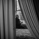 Grandmother Souad, 58, prays in the window of her bedroom at the family’s apartment.